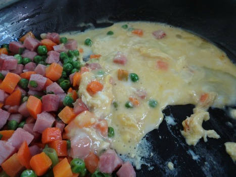 Eggs added to Ham and Vegetables for Fried Rice